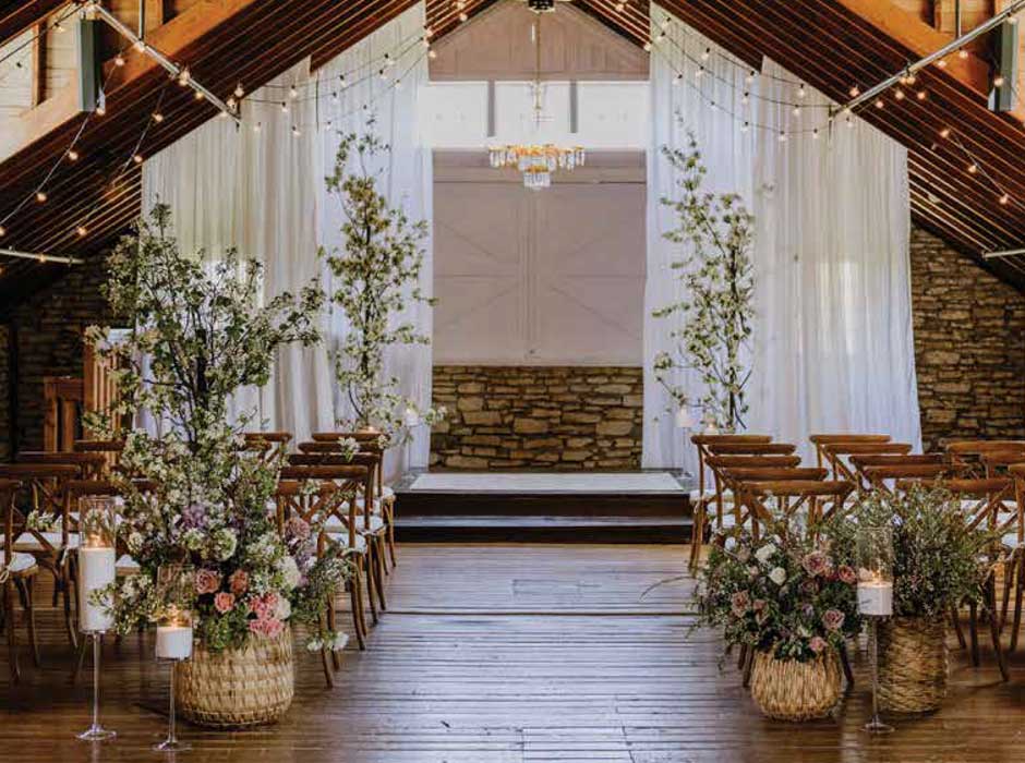 Mayowood Stone Barn wedding and event venue in Rochester, sets up for wedding cereomony.